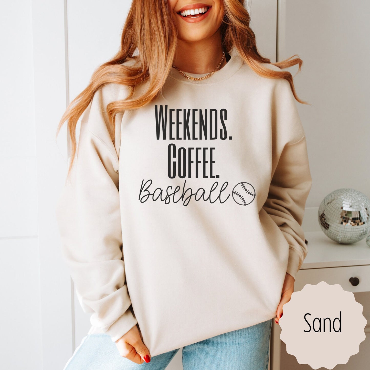 Baseball Mom Sweatshirt that says weekends coffee baseball with a black outlined baseball on the bottom. This sweatshirt comes in sand, white, black, gray, and heareth dark gray.