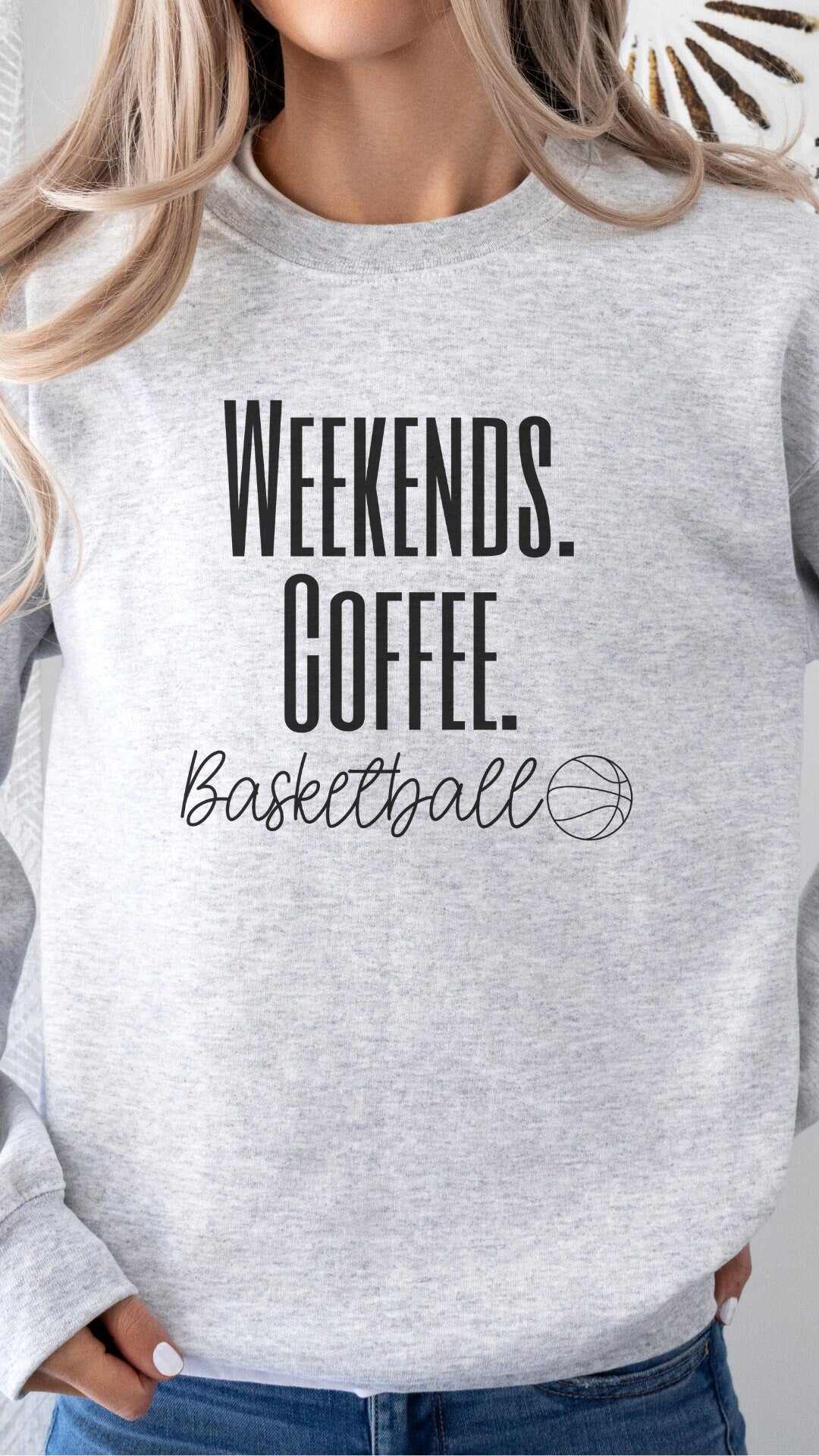 sports and coffee sweatshirt that says weekends coffee basketball with a black outlined basketball. This comes in ash gray, sand, black, white, or heathered dark gray.