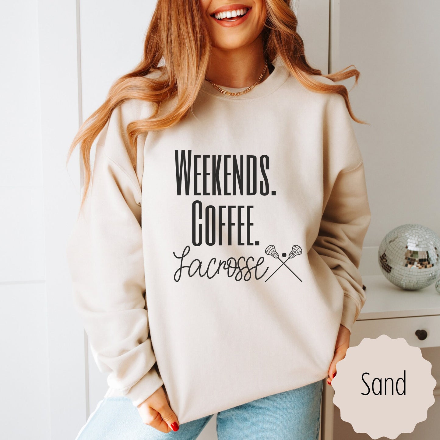 lacrosse hoodie for sports lover for Moms that says weekends coffee lacrosse with a black outlined lacrosse sticks on the bottom. This sweatshirt comes in sand, white, black, gray, and heareth dark gray.