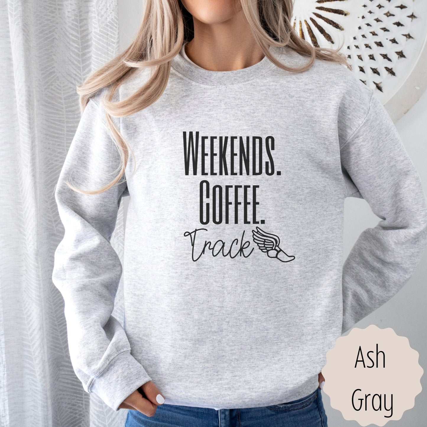 running lover shirt for Moms that says weekends coffee track with a black outlined flying shoe on the bottom. This sweatshirt comes in sand, white, black, gray, and heareth dark gray.