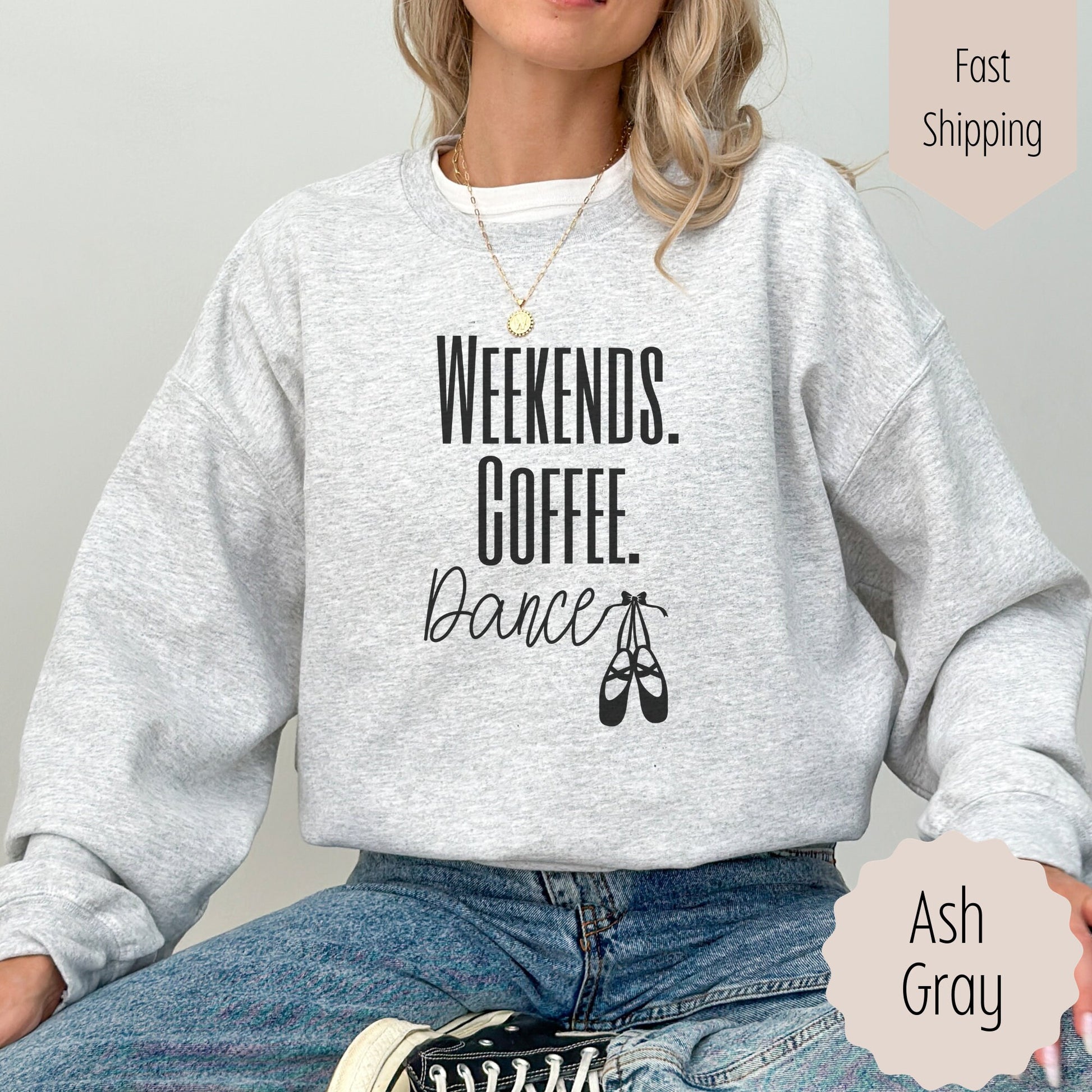 ballet sweatshirt that says weekends coffee dance with ballet slippers after the word dance. This sweatshirt comes in sand, black, white, dark heathered gray, and ash gray.